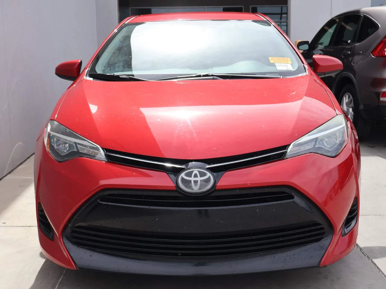 Used 2017 Barcelona Red Metallic Toyota LE image 4