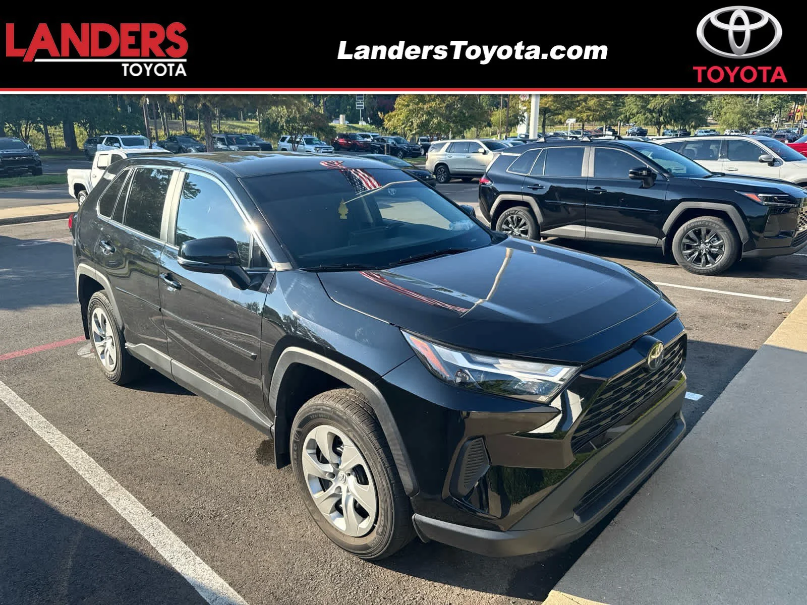 Used 2024 Midnight Black Metallic Toyota LE image 1