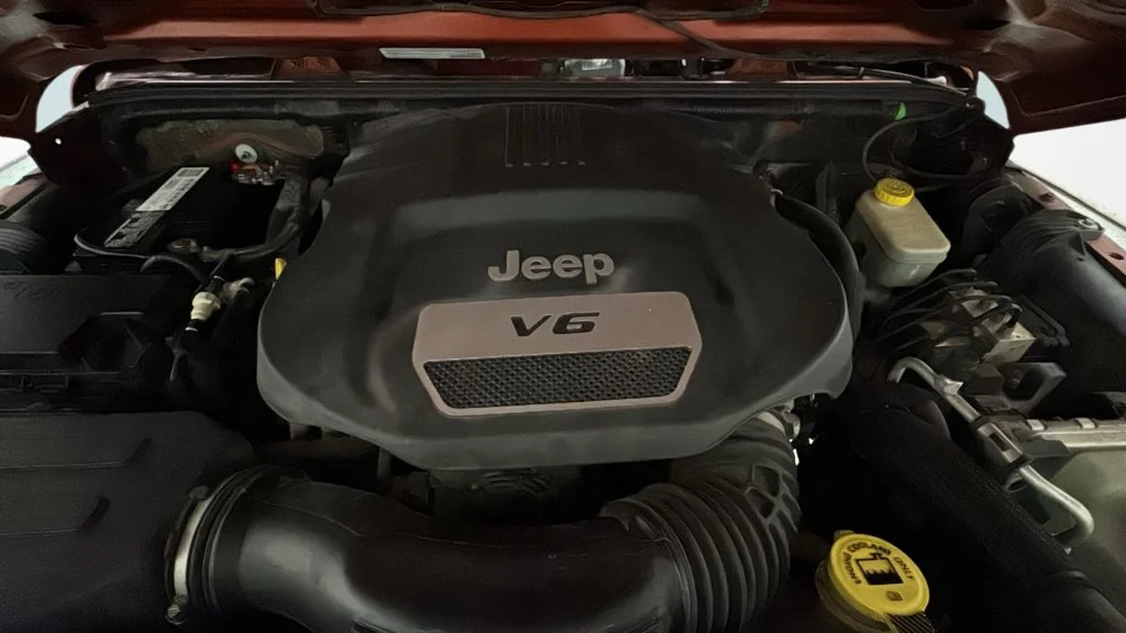 Used 2014 Orange Jeep Unlimited Sport image 16