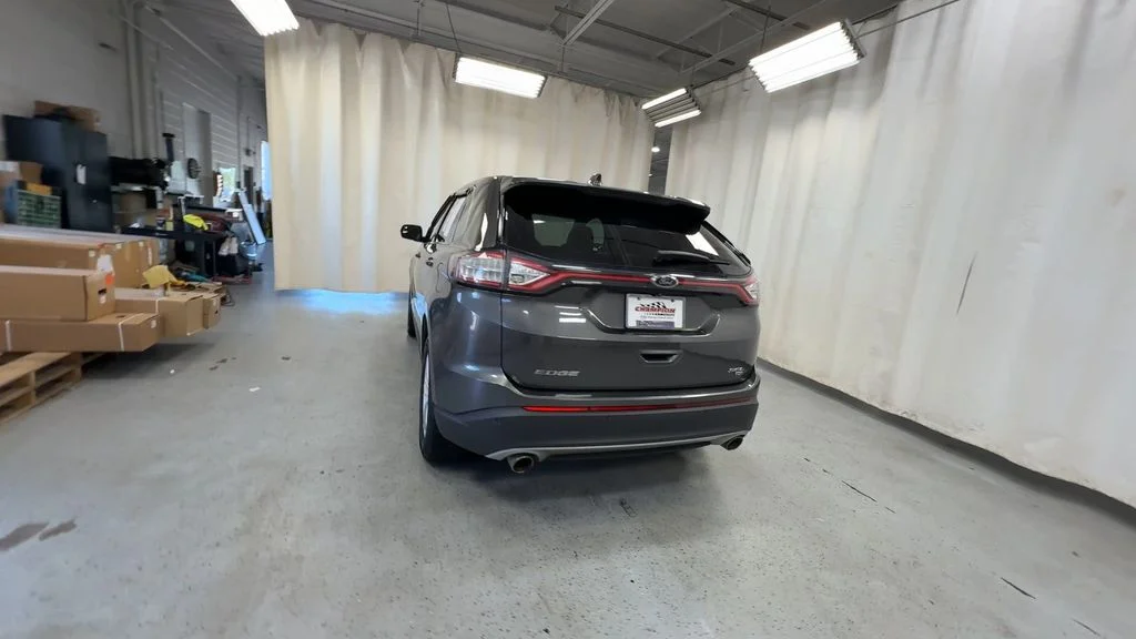 Used 2015 Magnetic Metallic Ford SEL image 9