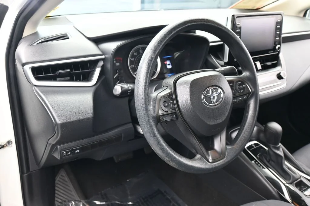 Used 2021 Super White Toyota LE image 13