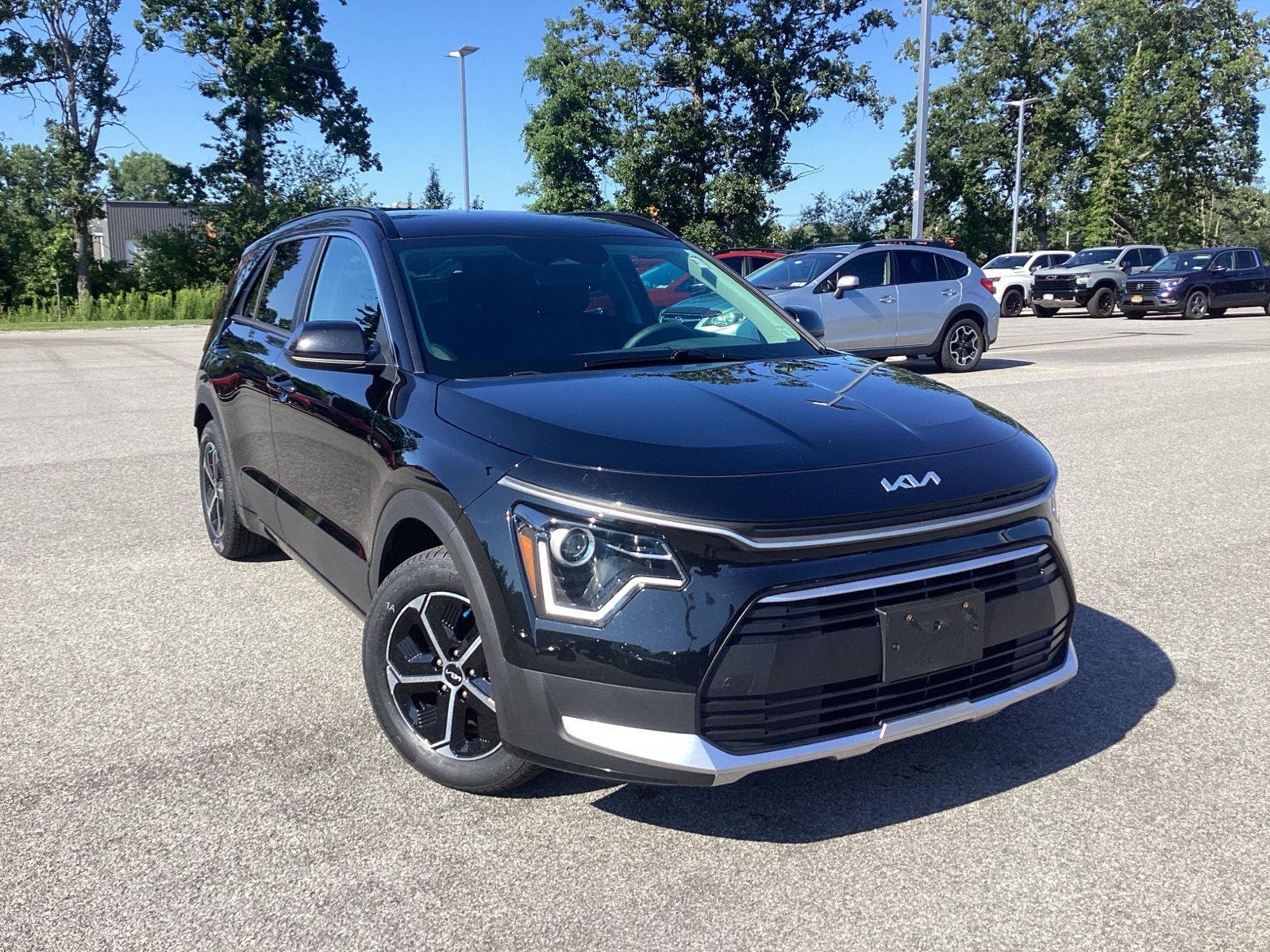 Used 2024 Aurora Black Pearl Kia LX image 1