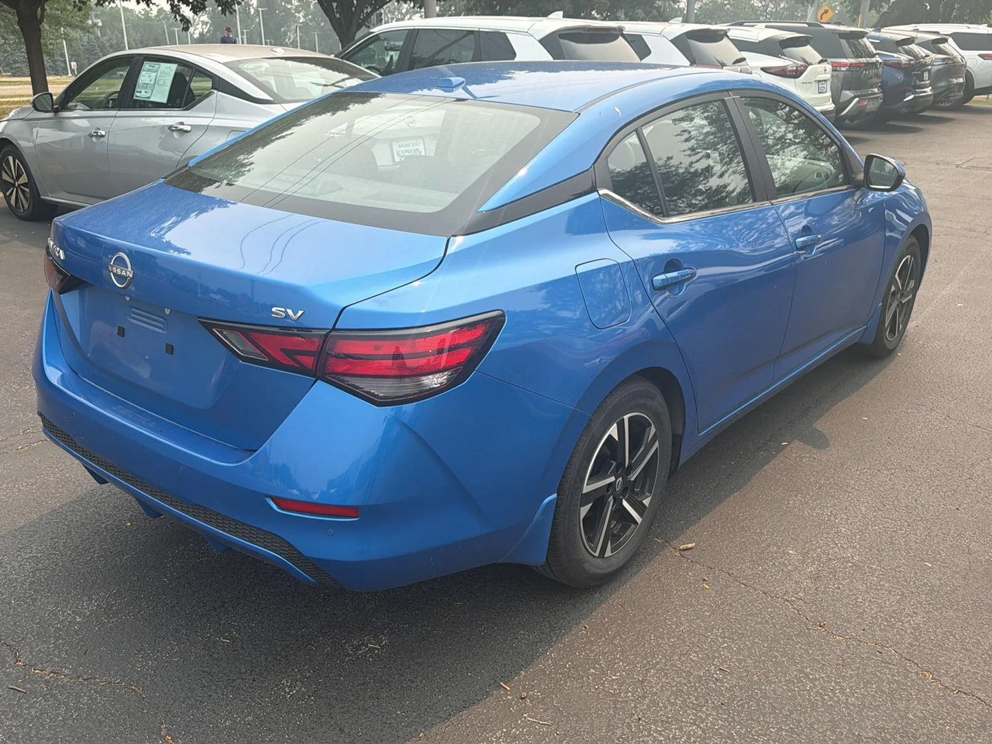 Used 2024 Electric Blue Metallic Nissan SV image 4