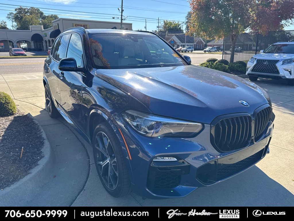 Used 2021 Blue Metallic BMW sDrive40i image 1