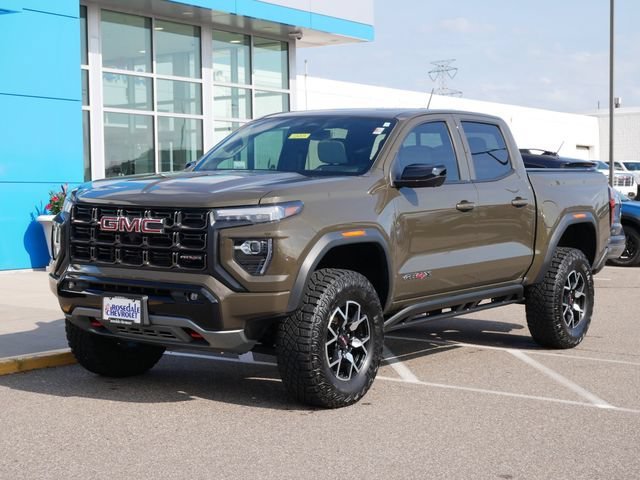 Used 2023 GMC Canyon AT4X with VIN 1GTP6EEK3P1262412 for sale in Roseville, Minnesota