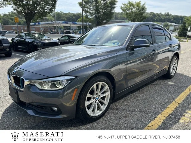 Used 2018 Mineral Gray Metallic BMW 320i xDrive image 1