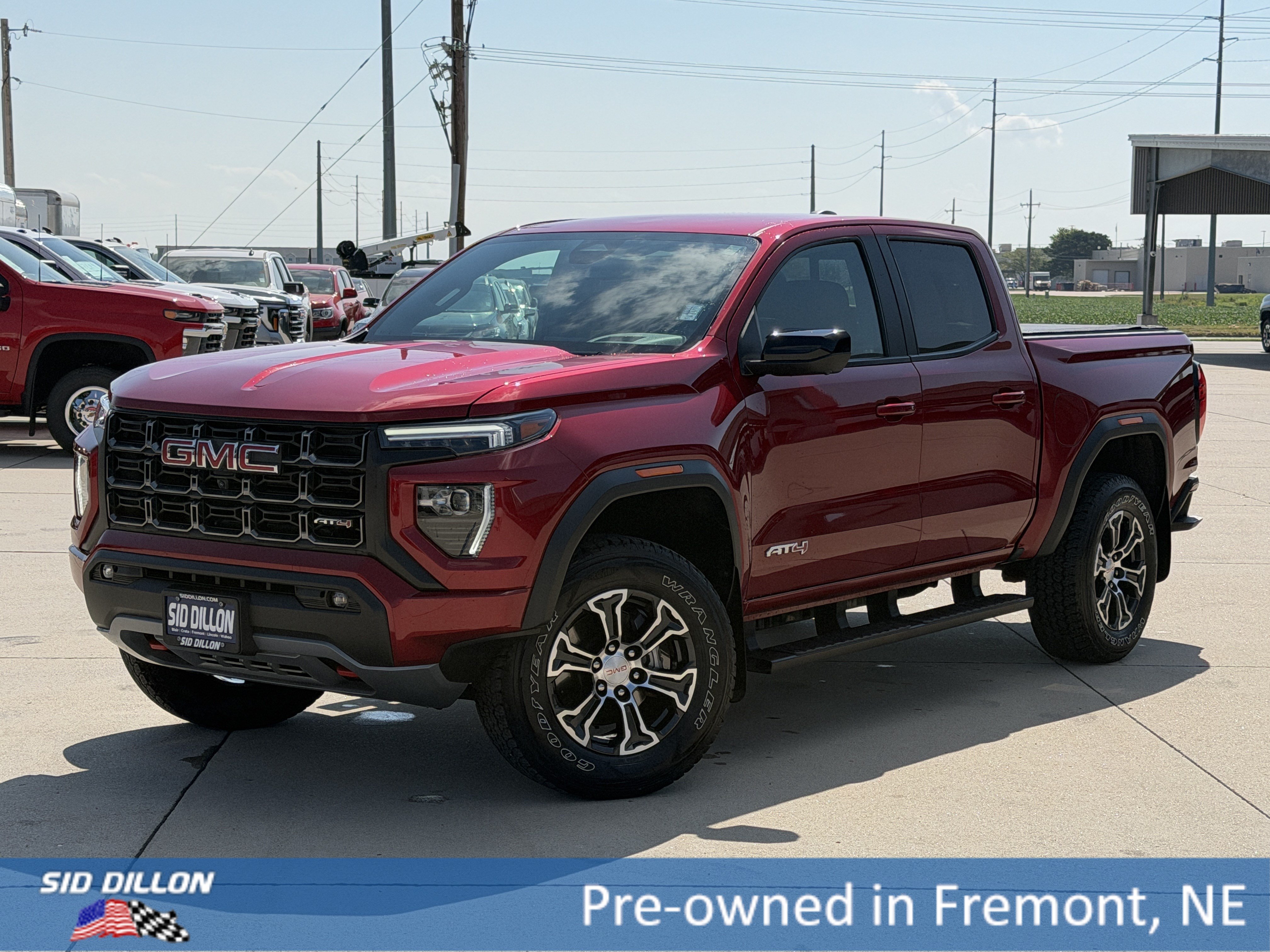 Used 2024 Volcanic Red Tintcoat GMC 4WD AT4 image 1