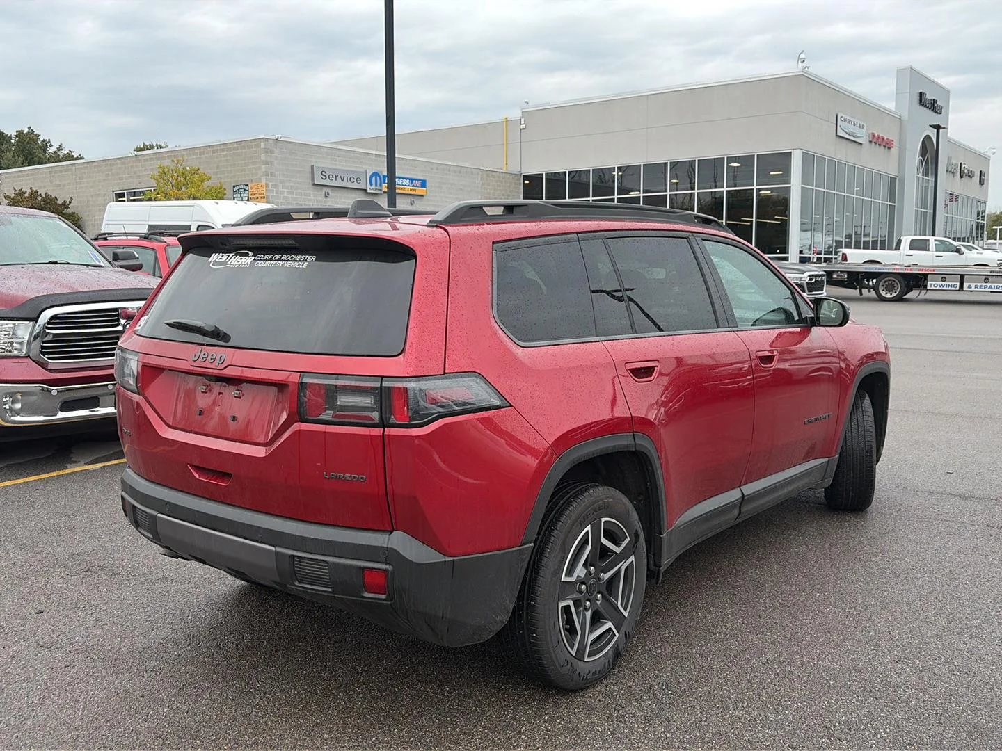 Used 2026 Red Hot Pearlcoat Jeep Laredo image 2