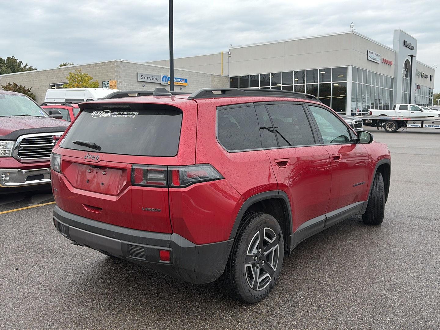 Used 2026 Red Hot Pearlcoat Jeep Laredo image 2