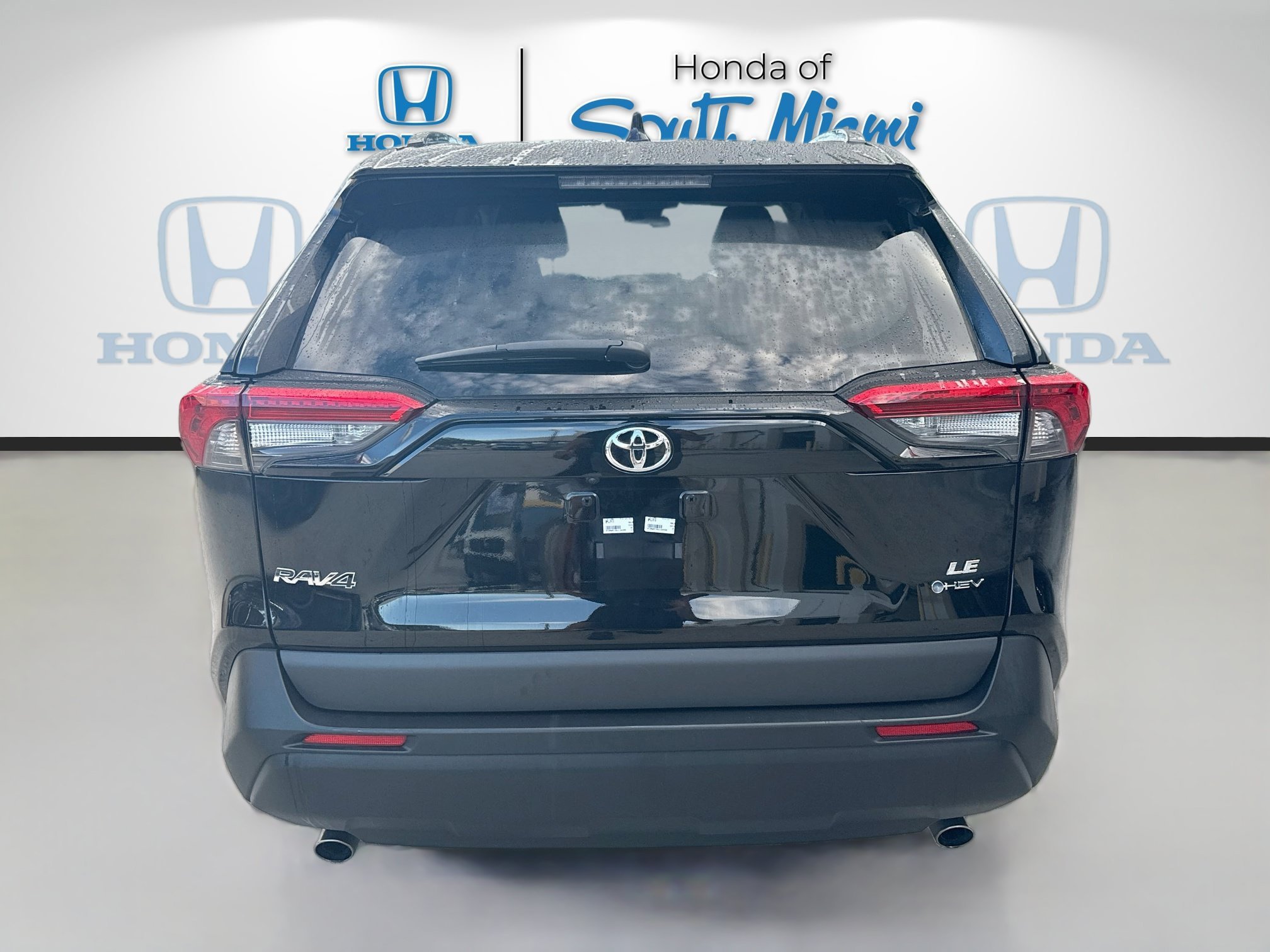 Used 2025 Midnight Black Metallic Toyota Hybrid LE image 6