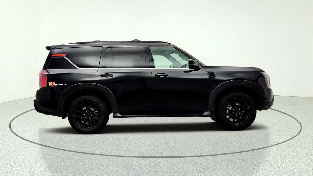 Used 2025 Super Black Nissan 4x4 PRO-4X w/ Cross Bars image 4