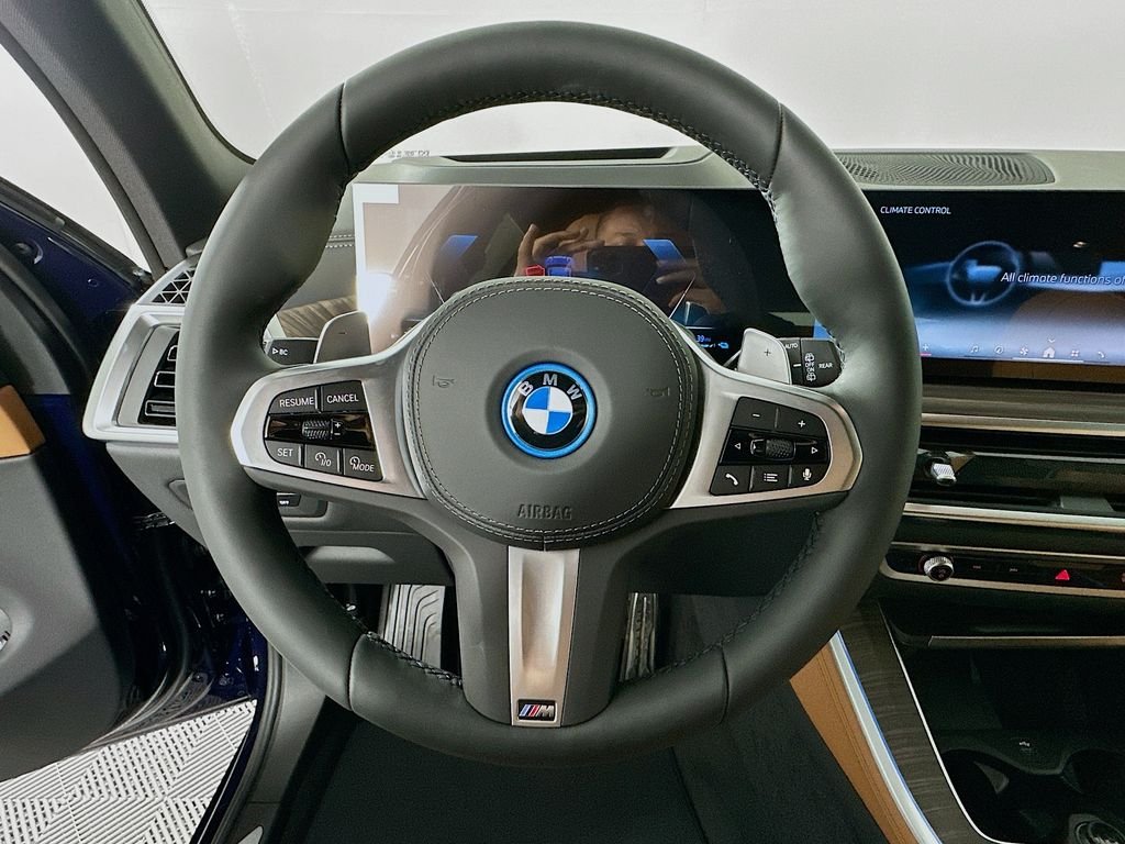 Used 2026 Tanzanite Blue II Metallic BMW xDrive50e image 10
