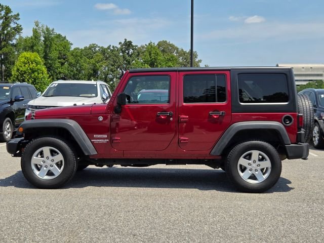 Used 2013 Red Jeep Unlimited Sport image 2