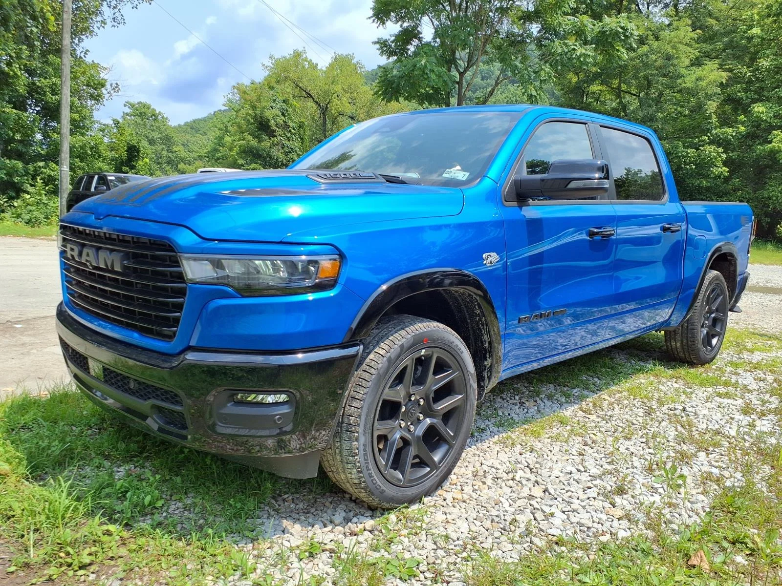 New 2026 Hydro Blue Pearl-Coat Exterior Paint RAM Laramie image 3