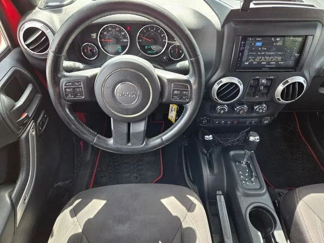 Used 2015 Red Jeep Unlimited Sahara image 15
