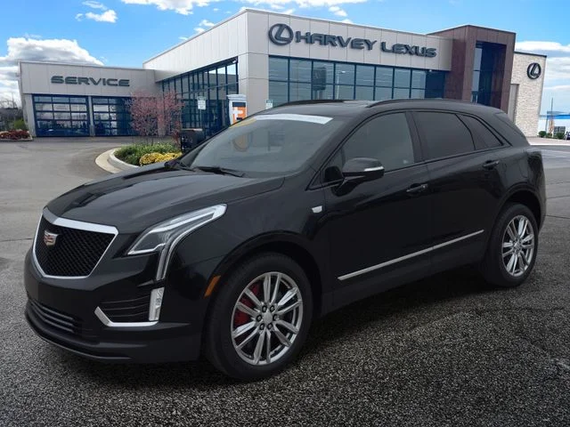 Used 2024 Black Metallic Cadillac Sport image 1