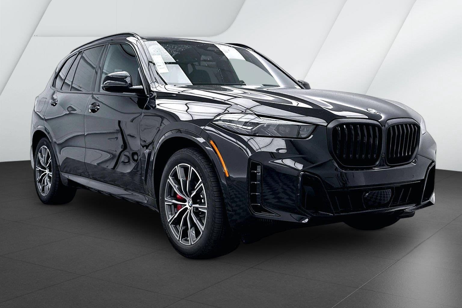 New 2026 Black Sapphire Metallic BMW xDrive50e image 1