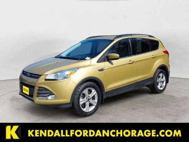 Used 2015 Gold Ford SE image 1