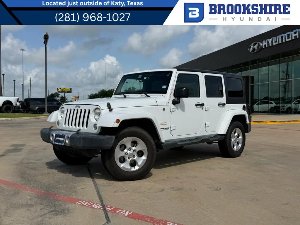 Used 2014 Bright White Clearcoat Jeep Sahara image 1