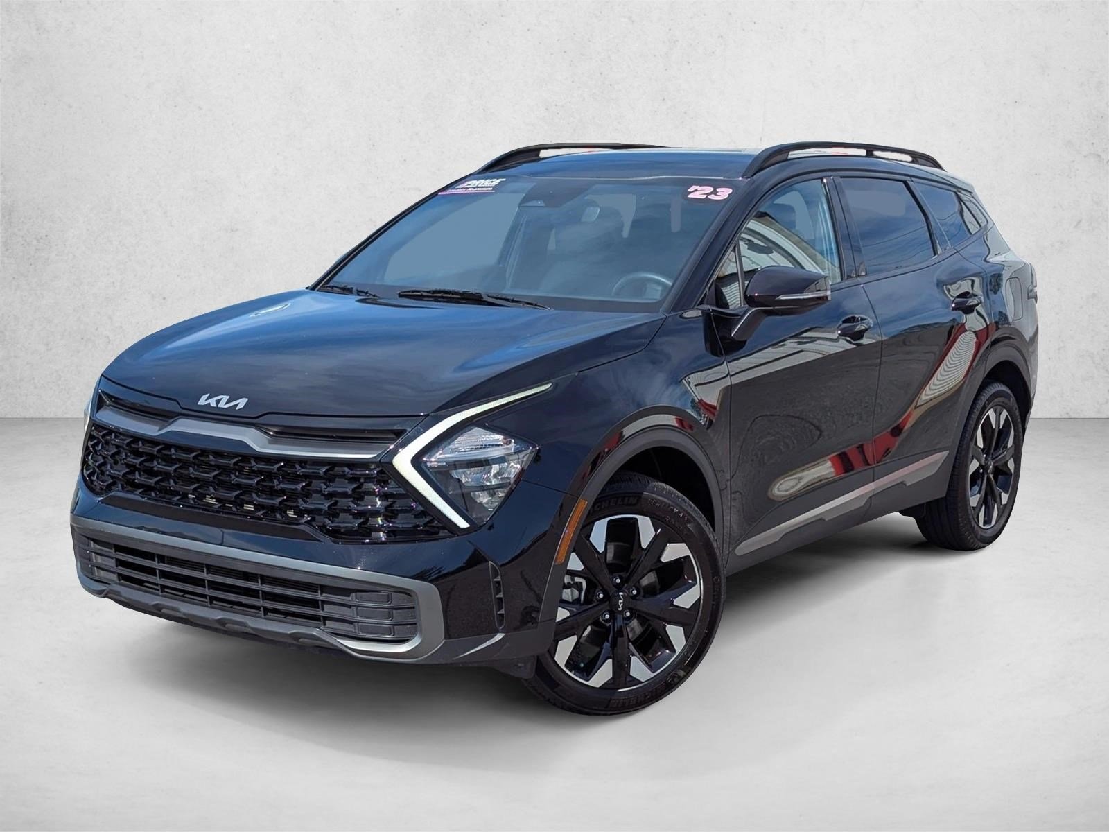 Used 2023 Ebony Black Kia X-Line image 1