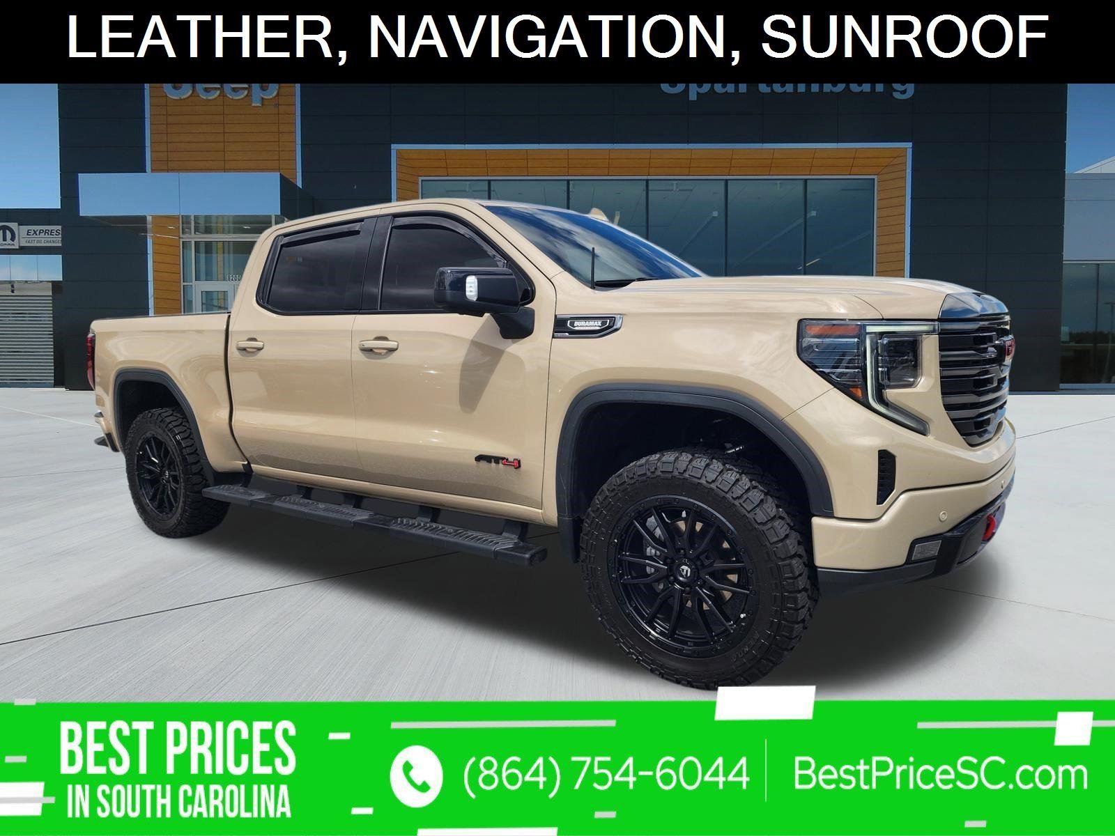 Used 2023 Desert Sand Metallic GMC AT4 image 1