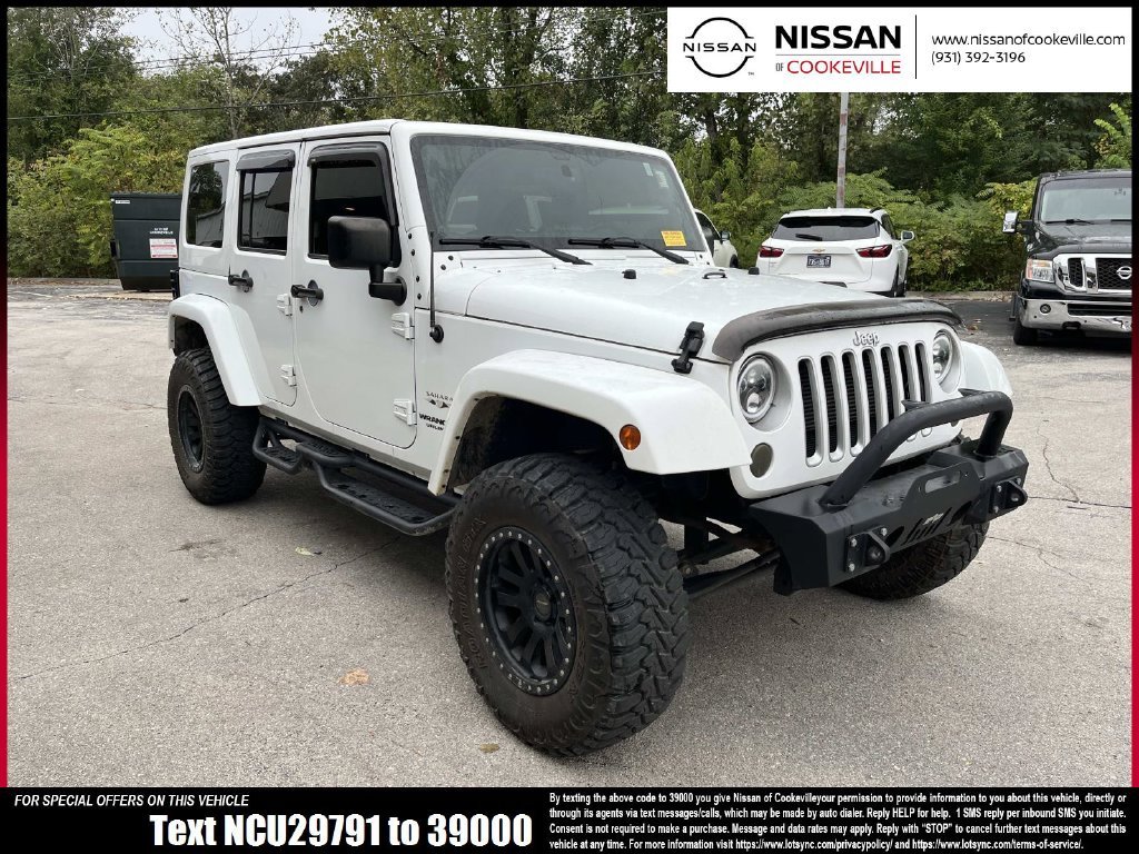 Used 2016 White Jeep Unlimited Sahara image 1