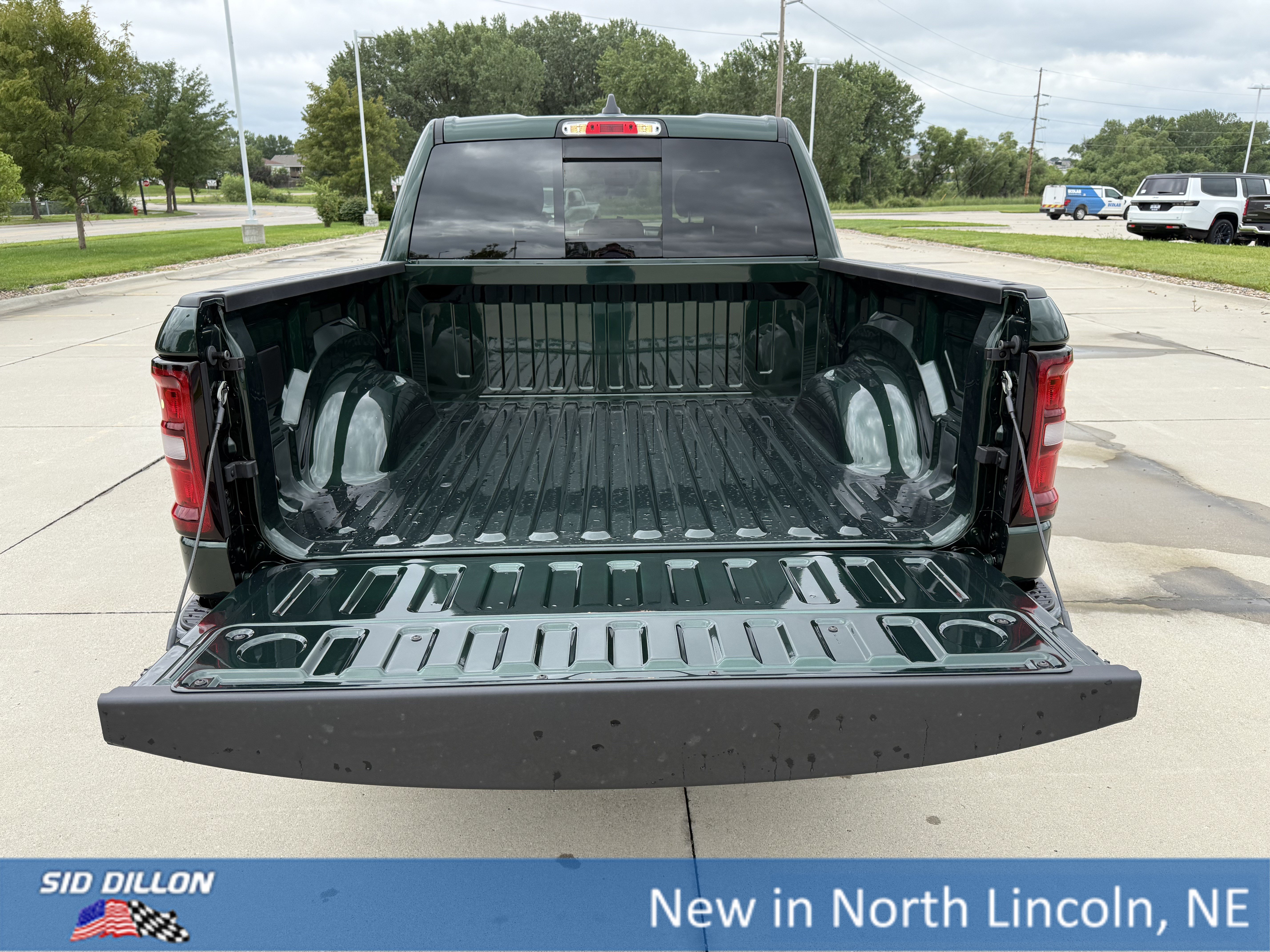 New 2026 Serrano-Green Metallic Exterior Paint RAM 4WD CREW 5