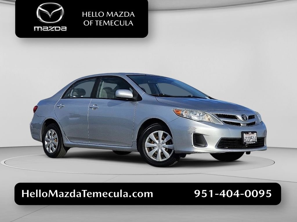 Used 2011 Classic Silver Metallic Toyota LE image 1