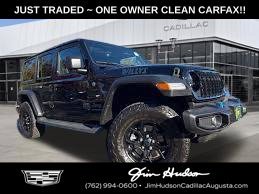 Used 2024 Black Jeep Sport image 1