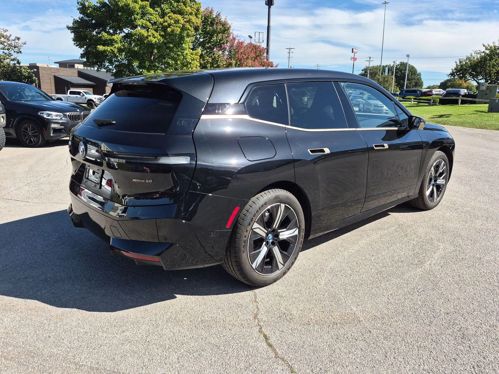 Used 2024 Black Sapphire Metallic BMW xDrive50 image 5