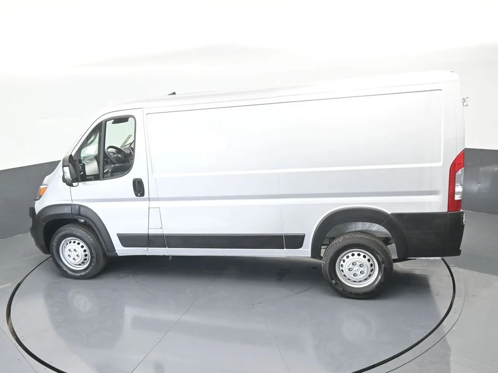 Used 2025 Bright Silver Clearcoat Metallic Ram Low Roof image 39