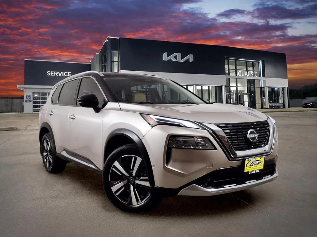 Used 2023 Gold Nissan Platinum image 1
