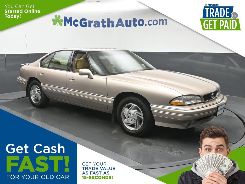 Used 1995 Beige Pontiac SE image 1