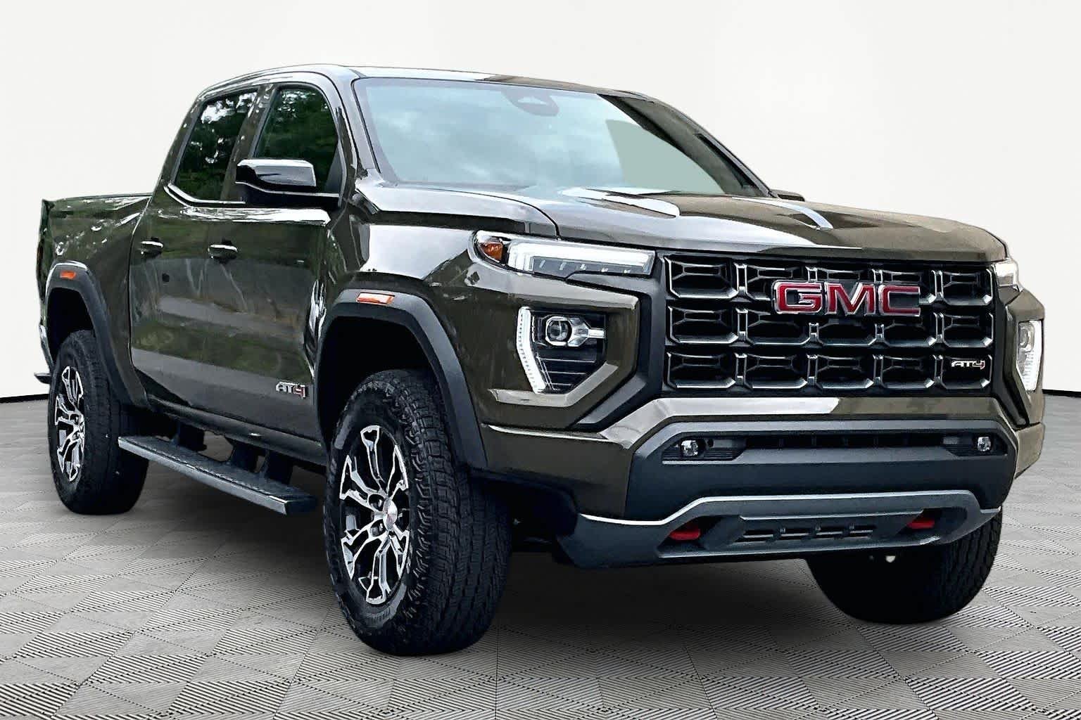Used 2023 Deep Bronze Metallic GMC 4WD AT4 image 3