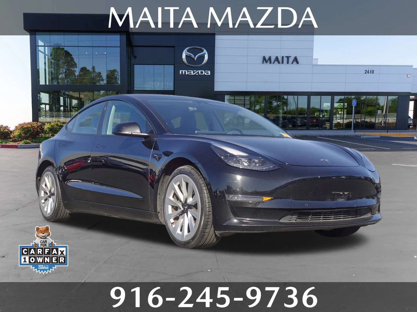 Used 2022 Solid Black Tesla Long Range image 1