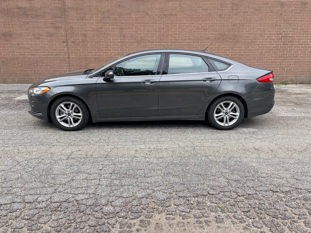 Used 2018 Magnetic Metallic Ford SE image 2