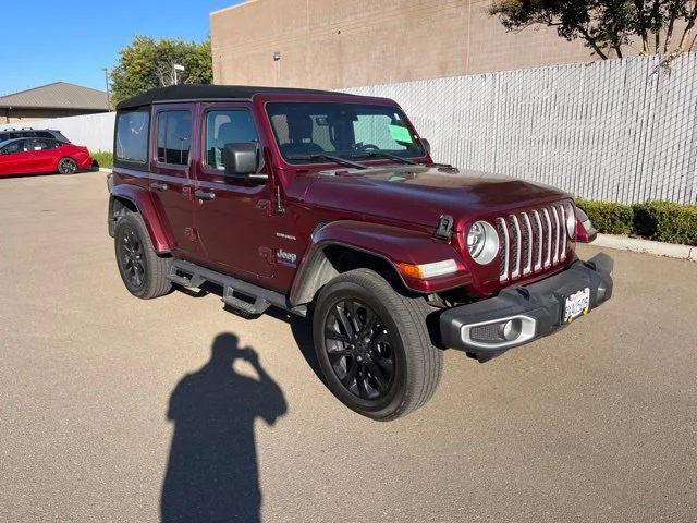 Used 2021 Snazzberry Pearlcoat Jeep Unlimited Sahara image 1
