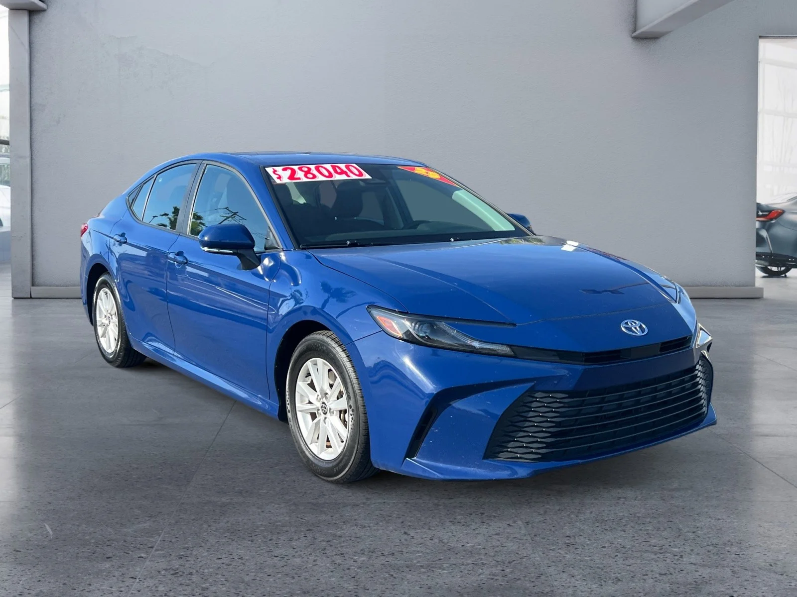 Used 2025 Reservoir Blue Toyota LE image 7