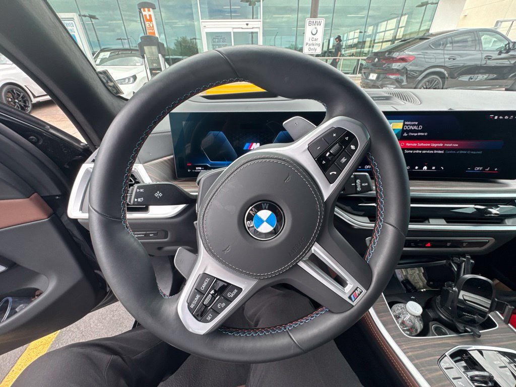 Certified Used 2026 Black Sapphire Metallic BMW M60i image 8