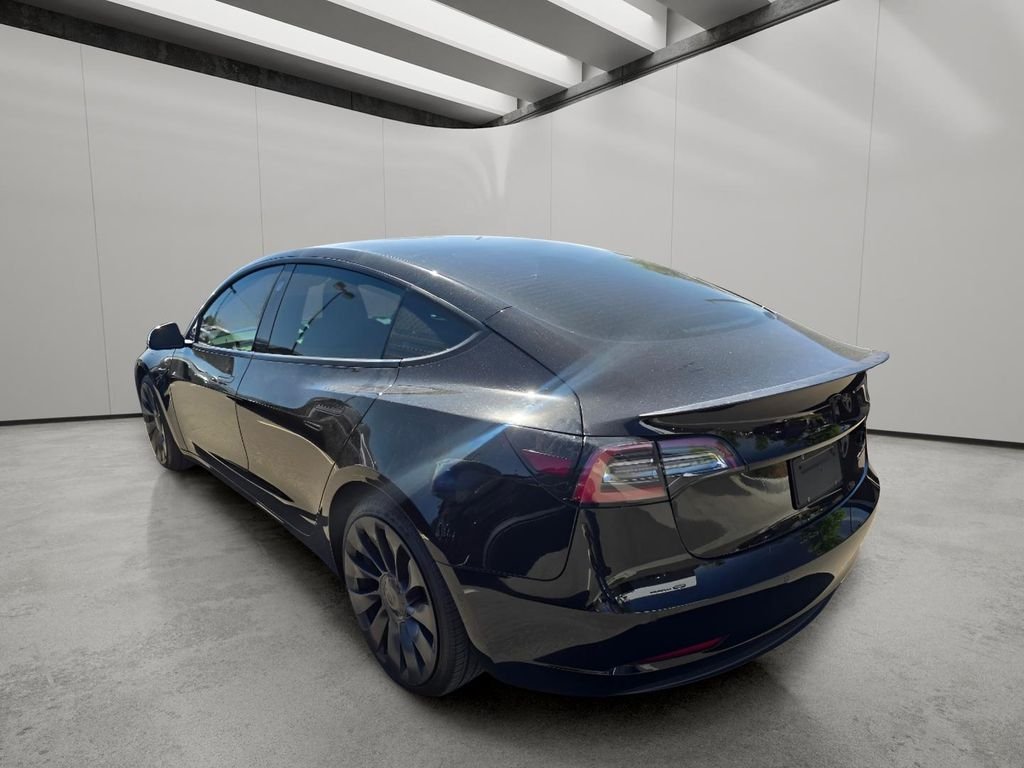 Used 2022 Solid Black Tesla Performance image 6