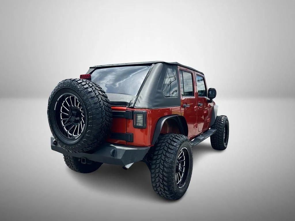 Used 2009 Orange Jeep Unlimited X image 4