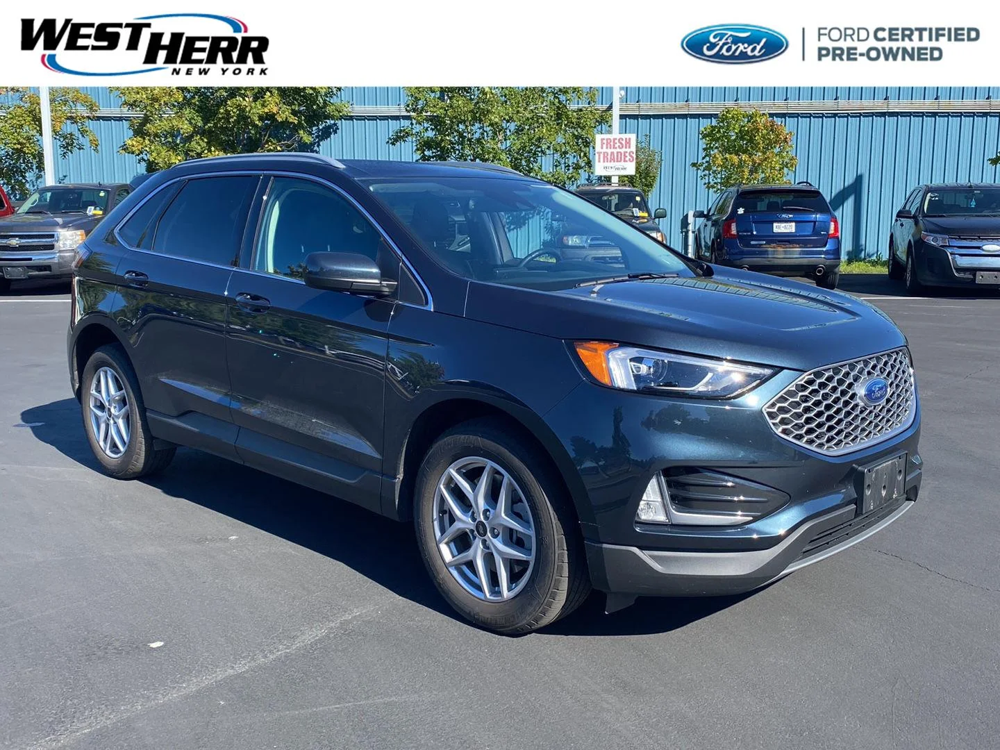 Used 2024 Stone Blue Ford SEL image 1