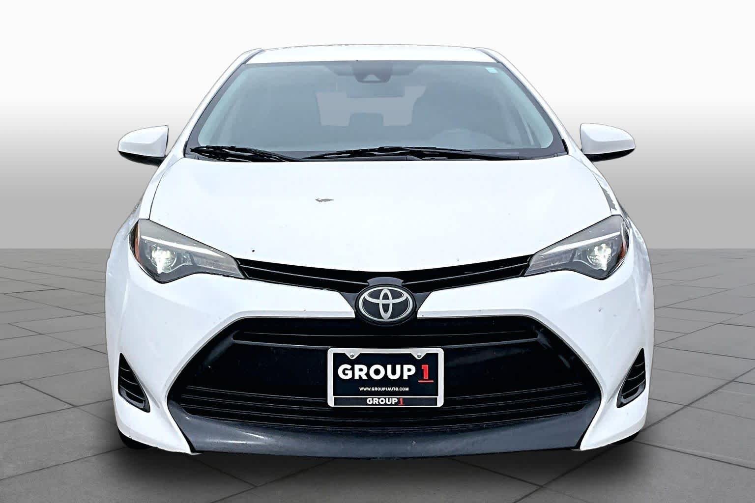 Used 2018 Super White Toyota LE image 4