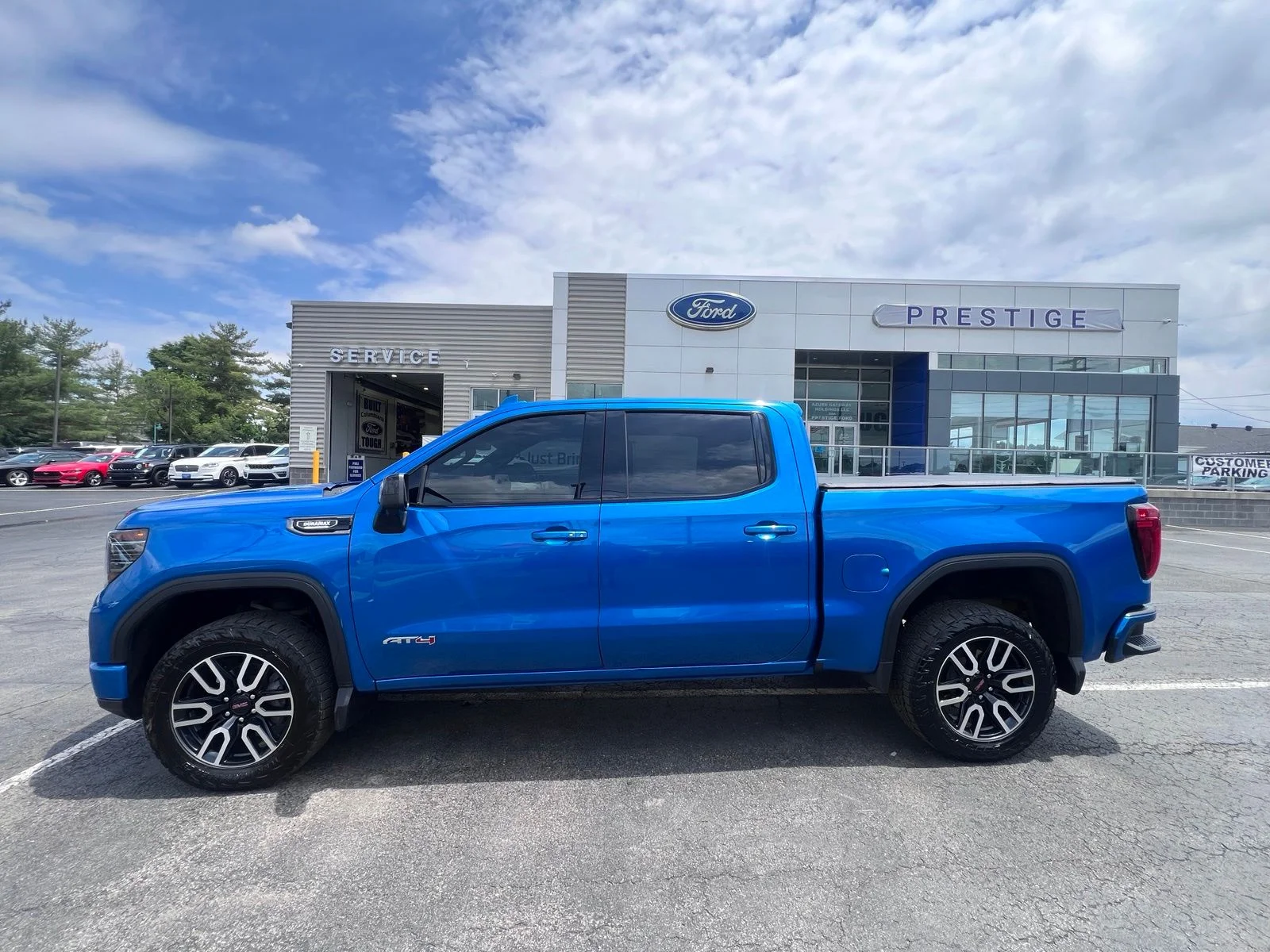 Used 2024 Blue Metallic GMC AT4 image 4