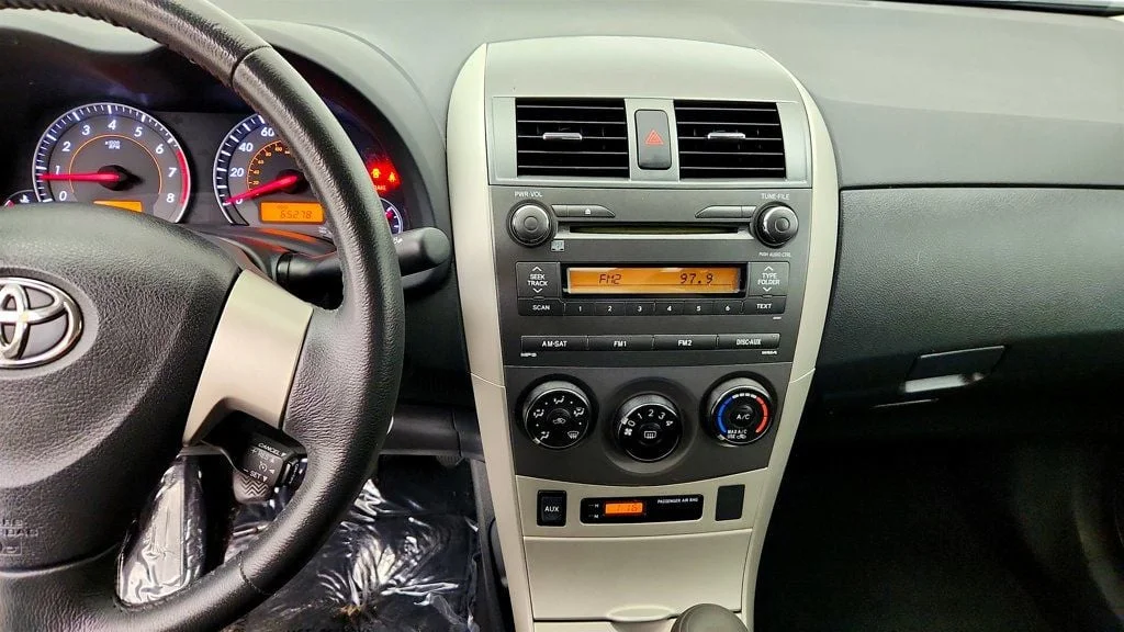 Used 2010 Classic Silver Metallic Toyota 4dr Sedan Manual S w/ Power Moonroof & 16
