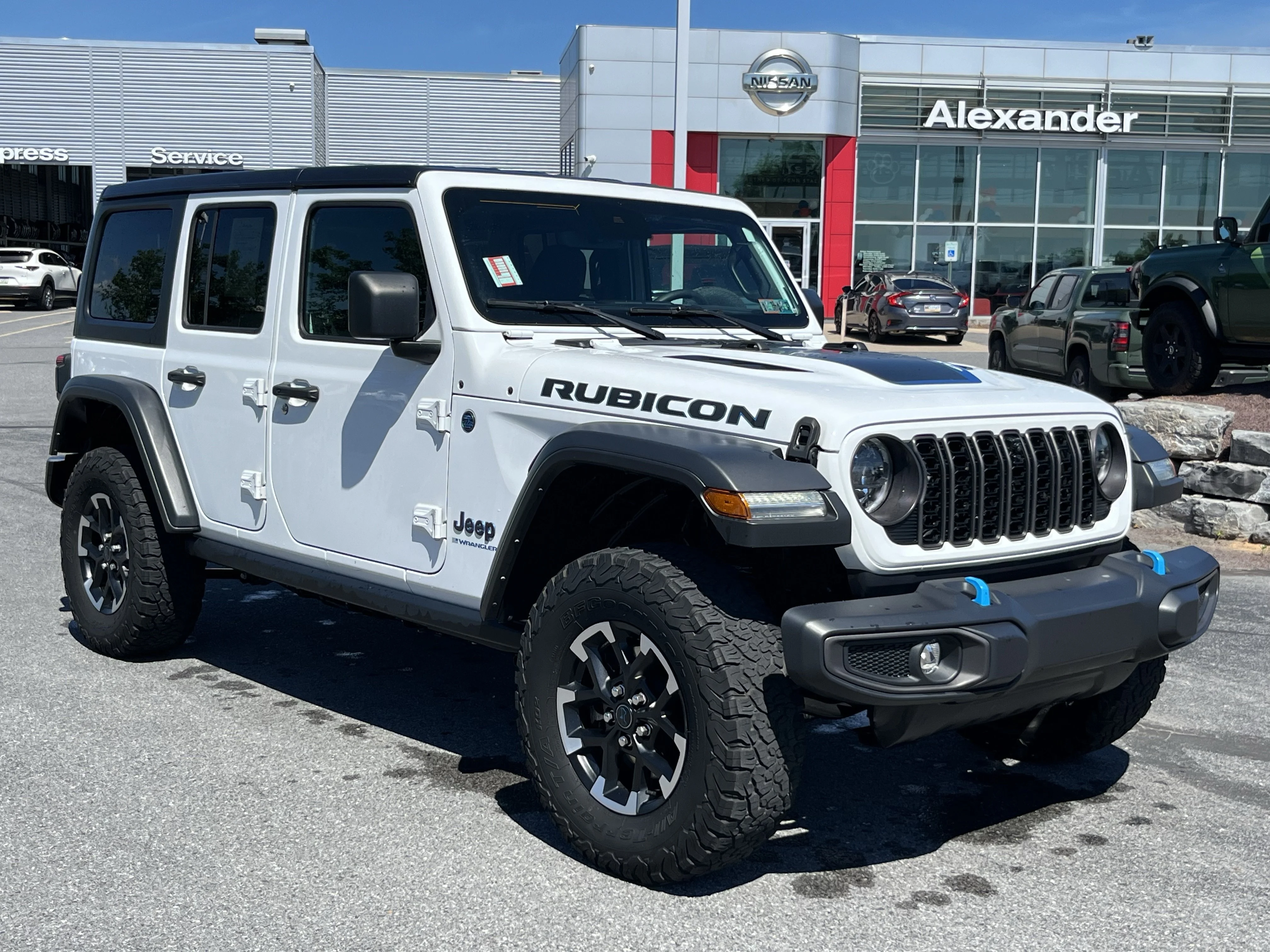 Used 2024 Bright White Clearcoat Jeep Rubicon 4xe image 1