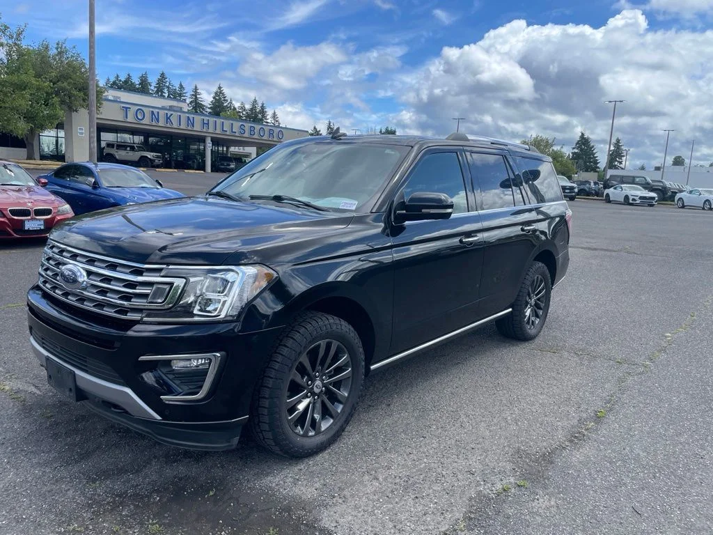 Used 2021 Black Metallic Ford Limited image 1