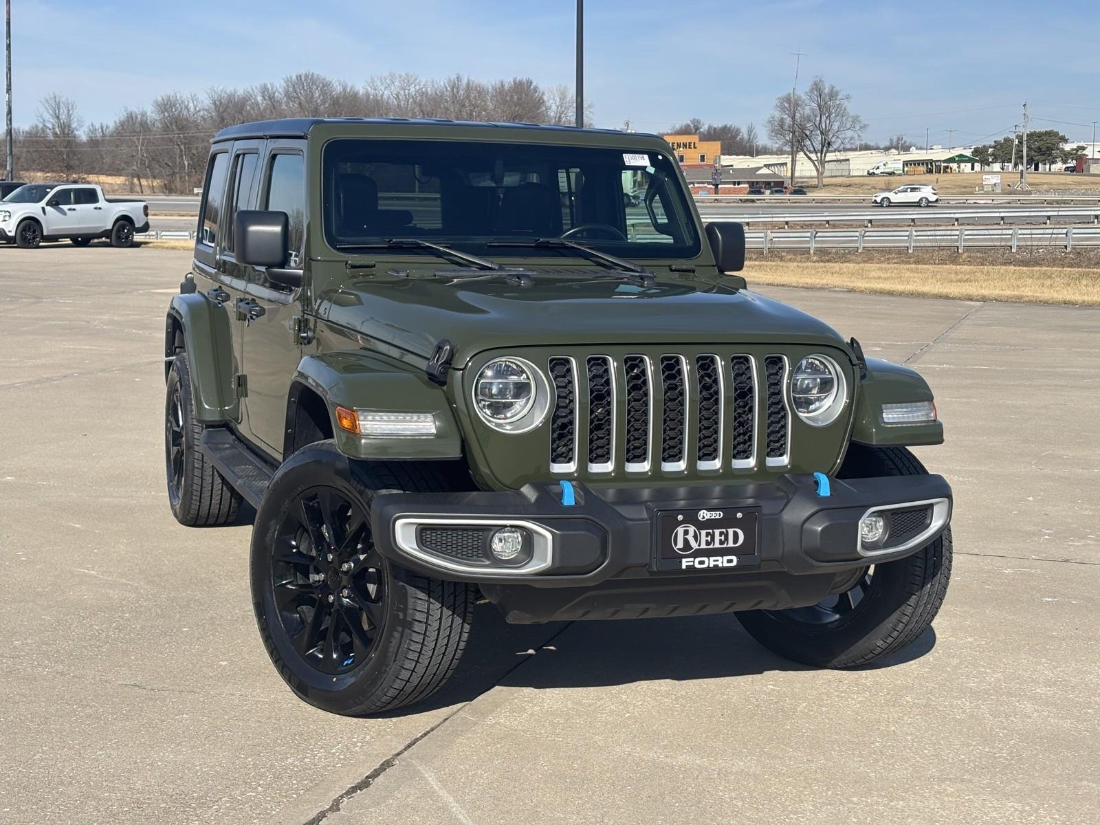 Used 2022 Jeep Wrangler Unlimited Sahara 4XE with VIN 1C4JJXP6XNW232274 for sale in Kansas City