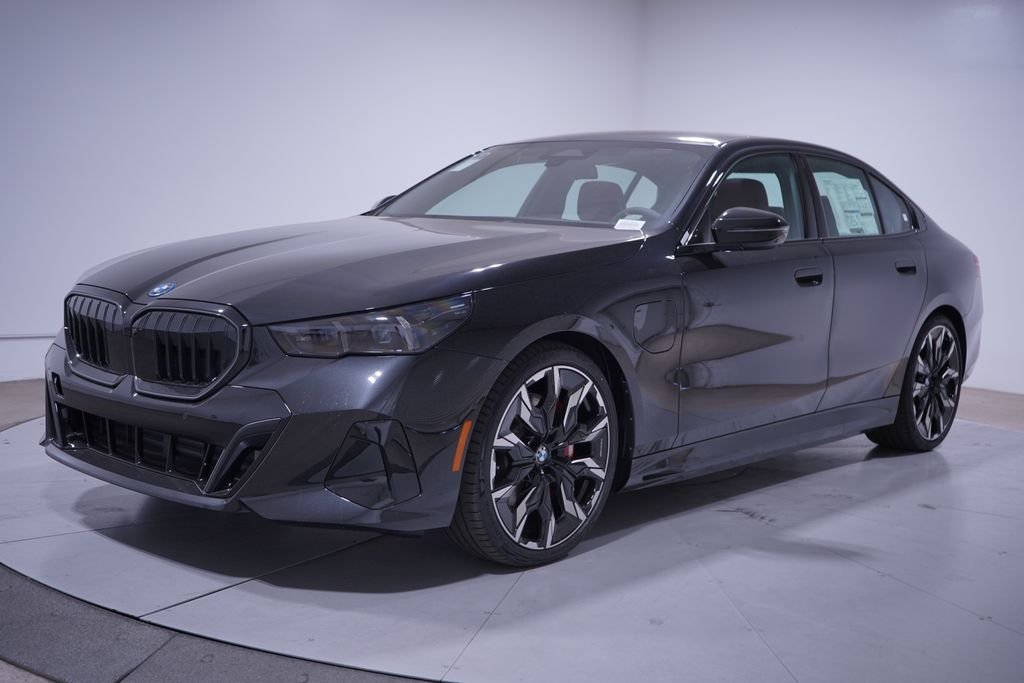 New 2027 Black Sapphire Metallic BMW 550e xDrive image 1