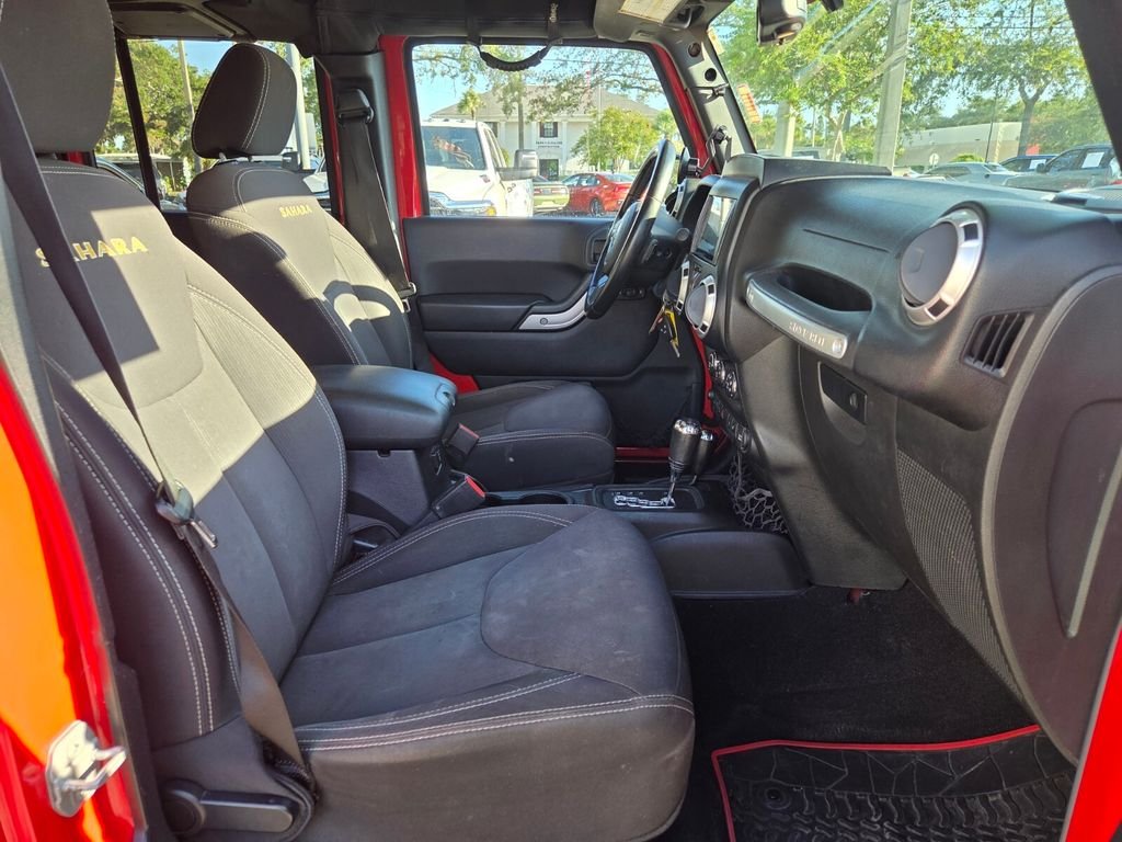 Used 2015 Red Jeep Unlimited Sahara image 16